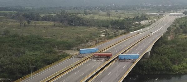 This image taken from video, shows a fuel tanker, cargo trailers and makeshift fencing, blocking the Tienditas International Bridge in an attempt to stop humanitarian aid entering from Colombia, as seen from the outskirts of Cucuta, on Colombia's border with Venezuela, Wednesday, Feb. 6, 2019. Immigration authorities say the Venezuelan National Guard built the roadblock a day earlier. - Sputnik International