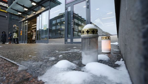 Candles burn outside the Valkea shopping centre, in memory of sex crimes committed against minors, in Oulu, Finland January 14, 2019. Candles burn outside the Valkea shopping centre, in memory of sex crimes committed against minors, in Oulu, Finland January 14, 2019. - Sputnik International
