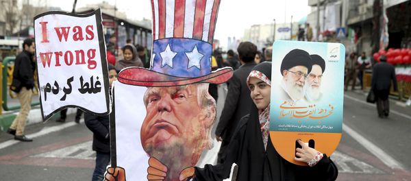An Iranian woman holds an effigy of US president Donald Trump, during a rally marking the 40th anniversary of the 1979 Islamic Revolution, in Tehran, Iran, Monday, Feb. 11, 2019 - Sputnik International