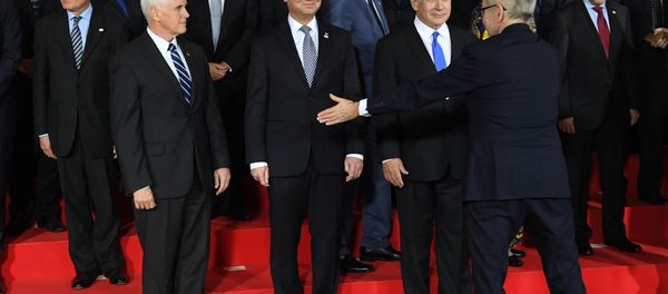 US Vice President Mike Pence, Poland's President Andrzej Duda and Prime minister of Israel Benjamin Netanyahu are seen during preparations for a family photo at the conference on Peace and Security in the Middle east in Warsaw, on February 13, 2019 - Sputnik International