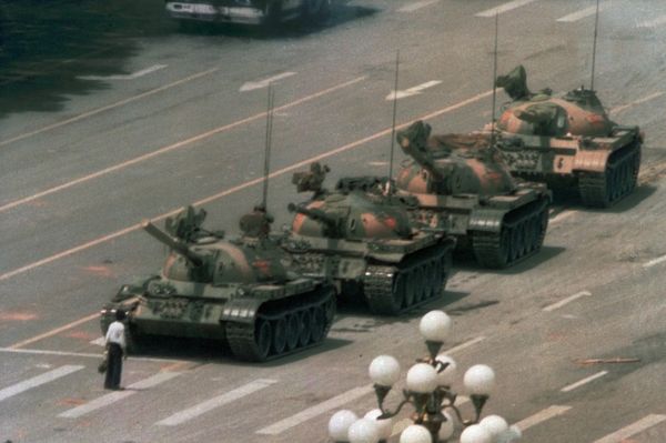 Tank Man blocks a column of Type 59 tanks heading east on Beijing's Chang'an Boulevard (Avenue of Eternal Peace) near Tiananmen Square during the Tiananmen Square protests of 1989. This photo was taken from the sixth floor of the Beijing Hotel, about half a mile away, through a 400 mm lens. The name and fate of the man is unknown Tank Man blocks a column of Type 59 tanks heading east on Beijing's Chang'an Boulevard (Avenue of Eternal Peace) near Tiananmen Square during the Tiananmen Square protests of 1989. This photo was taken from the sixth floor of the Beijing Hotel, about half a mile away, through a 400 mm lens. The name and fate of the man is unknown - Sputnik International
