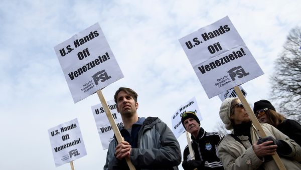 Activists rally against US intervention in Venezuela outside White House on January 26, 2019 in Washington, DC. Activists rally against US intervention in Venezuela outside White House on January 26, 2019 in Washington, DC. - Sputnik International