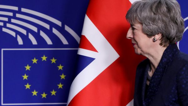 British Prime Minister Theresa May looks on at the EU parliament headquarters in Brussels, Belgium February 7, 2019. British Prime Minister Theresa May looks on at the EU parliament headquarters in Brussels, Belgium February 7, 2019. - Sputnik International