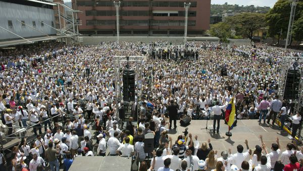 Nurses, doctors, professionals and others are sworn in by Venezuela’s self-proclaimed interim president Juan Guiado, as the group that will help with the arrival and distribution of humanitarian aid in Venezuela, during and event in Caracas, Venezuela, Saturday, Feb. 16, 2019. The U.S. Air Force has begun flying tons of aid to a Colombian town on the Venezuelan border as part of an effort meant to undermine socialist President Nicolas Maduro. The first of three C-17 cargo planes has flown from Homestead Air Reserve Base in Florida and landed in the town of Cucuta. - Sputnik International