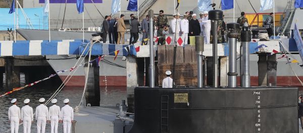 In this photo released by official website of the office of the Iranian Presidency, President Hassan Rouhani, centre with white turban, and other dignitaries attend the inauguration of Fateh, Conqueror in Persian, Iranian made a semi-heavy submarine in the southern port of Bandar Abbas, Iran, Sunday, Feb. 17, 2019. - Sputnik International