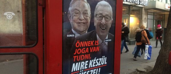 A phone box displays a billboards showing Hungarian-American financier George Soros and EU Commission President Jean-Claude Juncker above the caption “You have a right to know what Brussels is preparing to do!, on Vaci Avenue in Budapest, Hungary, Tuesday, Feb. 19, 2019 - Sputnik International
