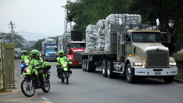 FILE PHOTO: Police escort trucks arriving at a warehouse, where international humanitarian aid for Venezuela will be stored according to authorities, near the Tienditas cross-border bridge between Colombia and Venezuela, in Cucuta, Colombia, Feb. 16, 2019. - Sputnik International