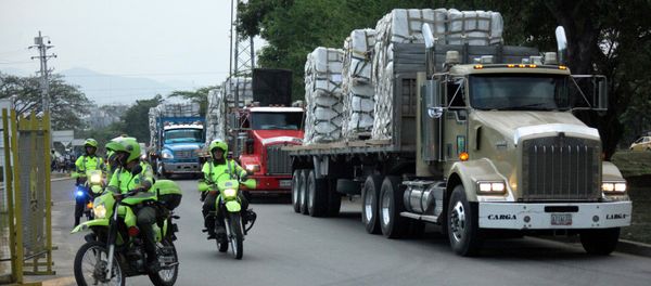 FILE PHOTO: Police escort trucks arriving at a warehouse, where international humanitarian aid for Venezuela will be stored according to authorities, near the Tienditas cross-border bridge between Colombia and Venezuela, in Cucuta, Colombia, Feb. 16, 2019. FILE PHOTO: Police escort trucks arriving at a warehouse, where international humanitarian aid for Venezuela will be stored according to authorities, near the Tienditas cross-border bridge between Colombia and Venezuela, in Cucuta, Colombia, Feb. 16, 2019. - Sputnik International
