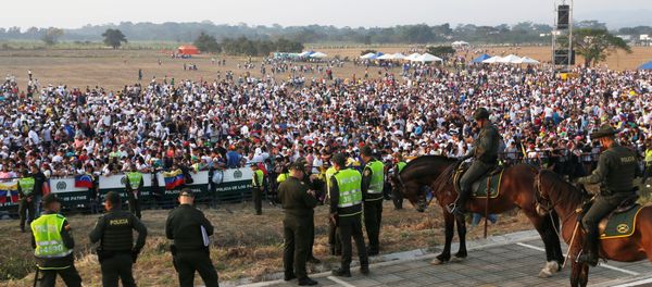 Police officers stand guard as people attend the Venezuela Aid Live concert near the Tienditas cross-border bridge between Colombia and Venezuela, in Cucuta, Colombia, February 22, 2019. Police officers stand guard as people attend the Venezuela Aid Live concert near the Tienditas cross-border bridge between Colombia and Venezuela, in Cucuta, Colombia, February 22, 2019. - Sputnik International