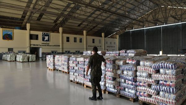 A Brazilian soldier walks near packages of rice and sugar that are part of the humanitarian aid for Venezuela, at Ala 7 air base in Boa Vista, Roraima state, Brazil in the border with Venezuela, on February 22, 2019. A Brazilian soldier walks near packages of rice and sugar that are part of the humanitarian aid for Venezuela, at Ala 7 air base in Boa Vista, Roraima state, Brazil in the border with Venezuela, on February 22, 2019. - Sputnik International