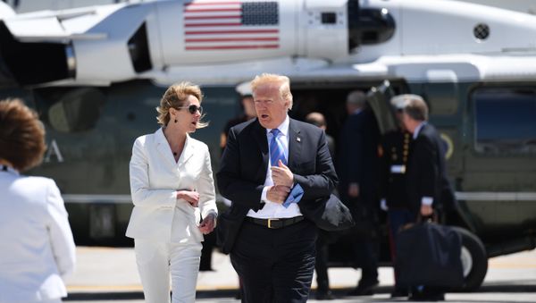 US President Donald Trump, with USAmbassador to Canada Kelly Knight Craft, walks to Air Force One prior to departure from Canadian Forces Base Bagotville in Canada, June 9, 2018. - Sputnik International