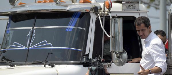 Venezuelan opposition leader Juan Guaido gives his thumb up from the side of a truck carrying humanitarian aid Venezuelan opposition leader Juan Guaido gives his thumb up from the side of a truck carrying humanitarian aid - Sputnik International
