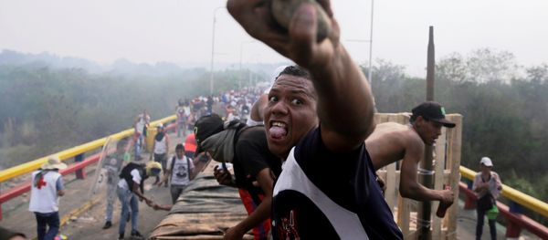Opposition supporters clash with Venezuela's security forces at Francisco de Paula Santander bridge on the border line between Colombia and Venezuela as seen from Cucuta, Colombia, February 23, 2019 - Sputnik International