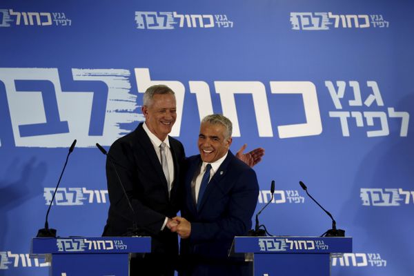 Retired Israeli military chief Benny Gantz, left, smiles with Yair Lapid, head of the Yesh Atid party as they launch joint list for the upcoming Israeli elections in Tel Aviv, Israel, Thursday, Feb. 21, 2019 - Sputnik International