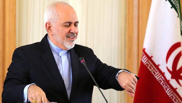 This picture taken on February 13, 2019 shows Iran's Foreign Minister Mohammad Javad Zarif checks his watch during a press conference in Tehran This picture taken on February 13, 2019 shows Iran's Foreign Minister Mohammad Javad Zarif checks his watch during a press conference in Tehran - Sputnik International