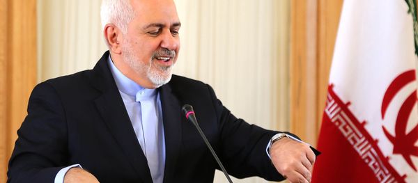 This picture taken on February 13, 2019 shows Iran's Foreign Minister Mohammad Javad Zarif checks his watch during a press conference in Tehran - Sputnik International