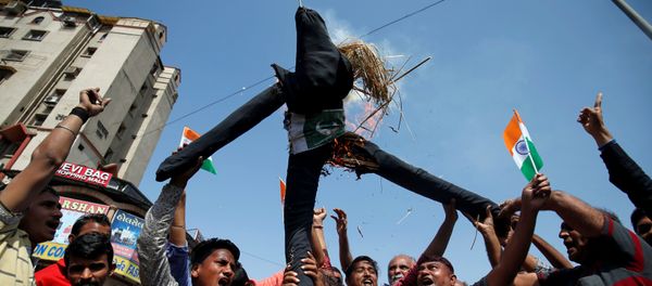 People burn an effigy depicting Pakistan as they celebrate after Indian authorities said their jets conducted airstrikes on militant camps in Pakistani territory, in Ahmedabad - Sputnik International