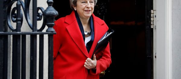 Theresa May leaves 10 Downing Street on her way to Parliament to offer MPs a vote on whether to leave the EU without a deal Theresa May leaves 10 Downing Street on her way to Parliament to offer MPs a vote on whether to leave the EU without a deal - Sputnik International