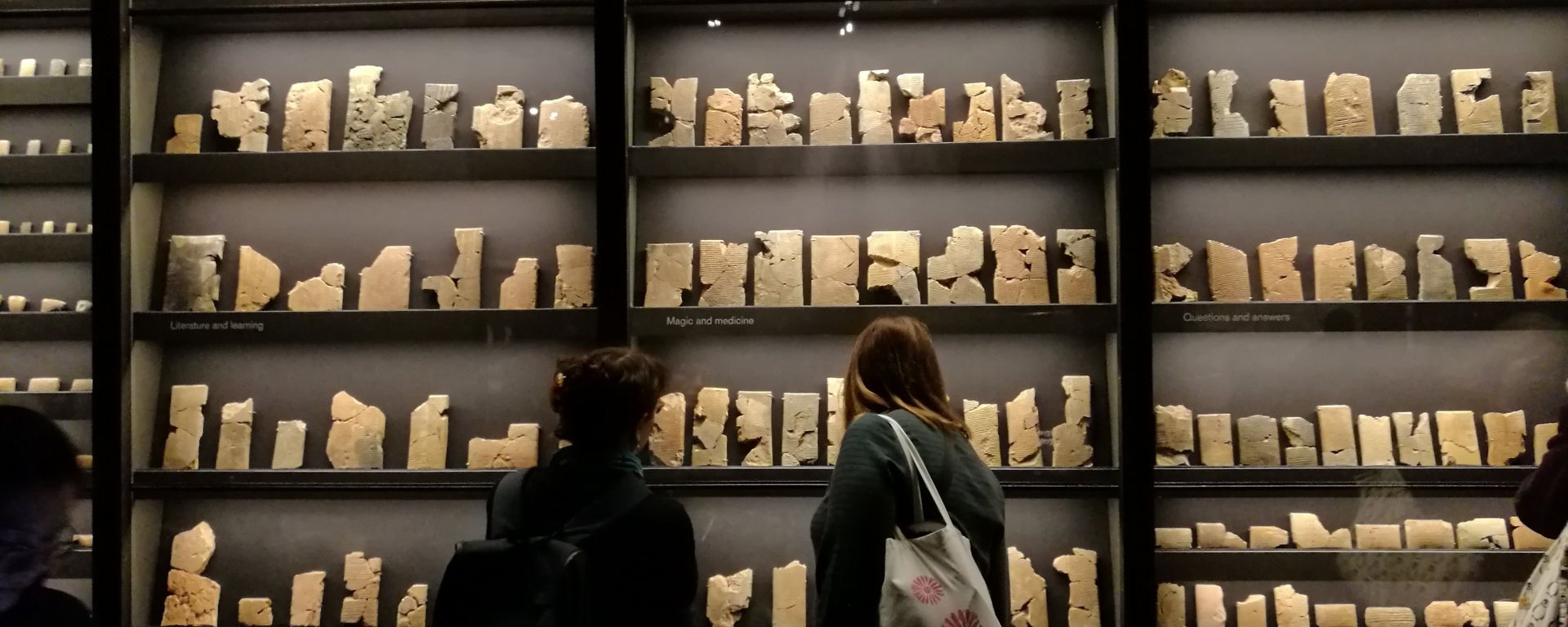 Visitors walk past a collection of 7th-century cuneiform texts from Ashurbanipal's personal library. - Sputnik International, 1920, 04.05.2023