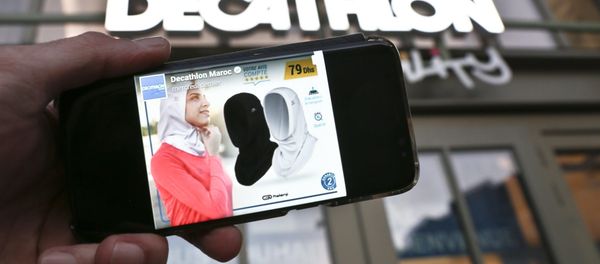 Sporting goods chain Decathlon has canceled plans to sell a sports version of the hijab Muslim headscarf in France after a public outcry Sporting goods chain Decathlon has canceled plans to sell a sports version of the hijab Muslim headscarf in France after a public outcry - Sputnik International