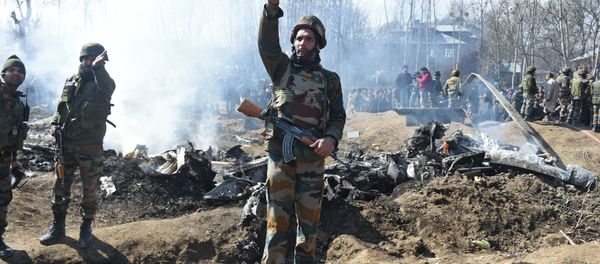 Indian soldiers gesture near the remains of an Indian Air Force aircraft after it crashed in Budgam district, some 30 kms from Srinagar on February 27, 2019 Indian soldiers gesture near the remains of an Indian Air Force aircraft after it crashed in Budgam district, some 30 kms from Srinagar on February 27, 2019 - Sputnik International