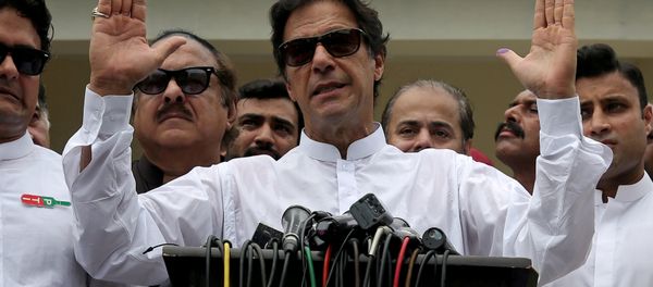 Cricket star-turned-politician Imran Khan, chairman of Pakistan Tehreek-e-Insaf (PTI), speaks after voting in the general election in Islamabad, July 25, 2018 Cricket star-turned-politician Imran Khan, chairman of Pakistan Tehreek-e-Insaf (PTI), speaks after voting in the general election in Islamabad, July 25, 2018 - Sputnik International