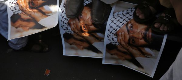 Demonstrators step on the posters of Maulana Masood Azhar, head of Pakistan-based militant group Jaish-e-Mohammad which claimed attack on a bus that killed 44 Central Reserve Police Force (CRPF) personnel in south Kashmir on Thursday, during a protest in Mumbai, India, February 15, 2019 Demonstrators step on the posters of Maulana Masood Azhar, head of Pakistan-based militant group Jaish-e-Mohammad which claimed attack on a bus that killed 44 Central Reserve Police Force (CRPF) personnel in south Kashmir on Thursday, during a protest in Mumbai, India, February 15, 2019 - Sputnik International