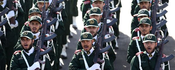 Members of the Iran's Revolutionary Guard march during an annual military parade marking the 34th anniversary of outset of the 1980-88 Iran-Iraq war, in front of the mausoleum of the late revolutionary founder Ayatollah Khomeini just outside Tehran, Iran, Monday, Sept. 22, 2014 - Sputnik International