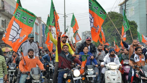 Indian Bharatiya Janata Party (BJP) workers hold BJP flags during a 'Vijay Sankalp' bike rally in Amritsar on March 2, 2019 Indian Bharatiya Janata Party (BJP) workers hold BJP flags during a 'Vijay Sankalp' bike rally in Amritsar on March 2, 2019 - Sputnik International