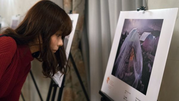 An exhibition of photos by winners of the Andrei Stenin International Press Photo Contest opened in Tokyo - Sputnik International
