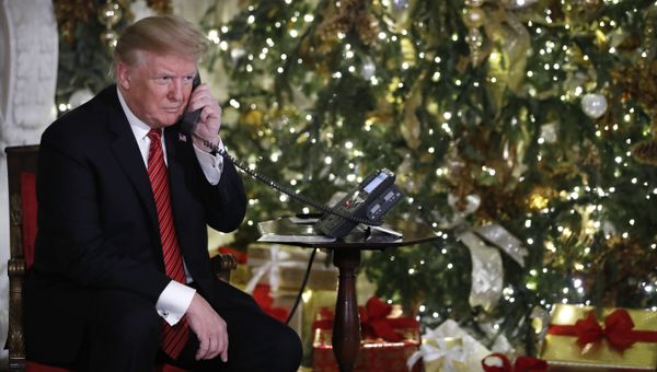 President Donald Trump listens on the phone as he shares updates to track Santa's movements from the North American Aerospace Defense Command (NORAD) Santa Tracker on Christmas Eve, Monday, Dec. 24, 2018 President Donald Trump listens on the phone as he shares updates to track Santa's movements from the North American Aerospace Defense Command (NORAD) Santa Tracker on Christmas Eve, Monday, Dec. 24, 2018 - Sputnik International