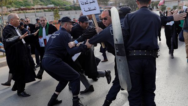 Police attempt to disperse lawyers trying to force their way to the constitutional council during a protest to denounce an offer by President Abdelaziz Bouteflika to run in elections next month but not to serve a full term if re-elected, in Algiers, Algeria March 7, 2019 Police attempt to disperse lawyers trying to force their way to the constitutional council during a protest to denounce an offer by President Abdelaziz Bouteflika to run in elections next month but not to serve a full term if re-elected, in Algiers, Algeria March 7, 2019 - Sputnik International