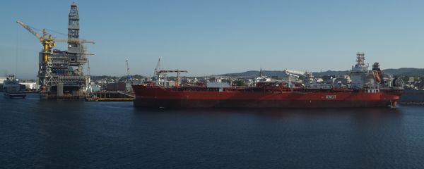 A KNOT oil tanker sails past a refinery in the Norwegian fjords. - Sputnik International