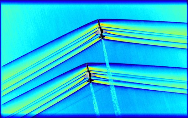 One of the greatest challenges of the flight series was timing. In order to acquire this image, originally monochromatic and shown here as a colorized composite image, NASA flew a B-200, outfitted with an updated imaging system, at around 30,000 feet while the pair of T-38s were required to not only remain in formation, but to fly at supersonic speeds at the precise moment they were directly beneath the B-200. The images were captured as a result of all three aircraft being in the exact right place at the exact right time designated by NASA’s operations team. - Sputnik International