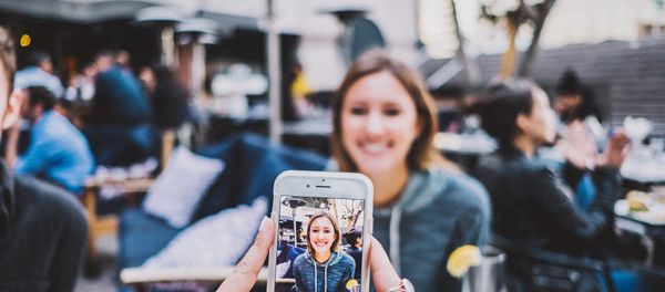 A person taking a photo with an iPhone - Sputnik International