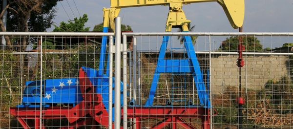 An oil pumpjack painted with the colors of the Venezuelan flag is seen in Lagunillas, Venezuela. File photo - Sputnik International