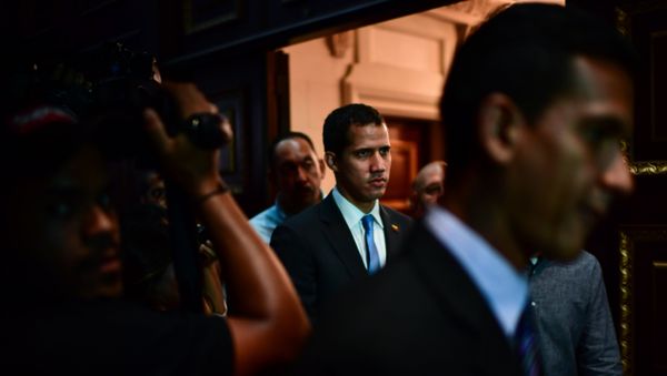 Venezuelan opposition leader and self-proclaimed acting president Juan Guaido (C) arrives at the Venezuelan National Assembly in Caracas on March 11, 2019. Venezuelan opposition leader and self-proclaimed acting president Juan Guaido (C) arrives at the Venezuelan National Assembly in Caracas on March 11, 2019. - Sputnik International