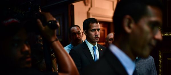 Venezuelan opposition leader and self-proclaimed acting president Juan Guaido (C) arrives at the Venezuelan National Assembly in Caracas on March 11, 2019. Venezuelan opposition leader and self-proclaimed acting president Juan Guaido (C) arrives at the Venezuelan National Assembly in Caracas on March 11, 2019. - Sputnik International