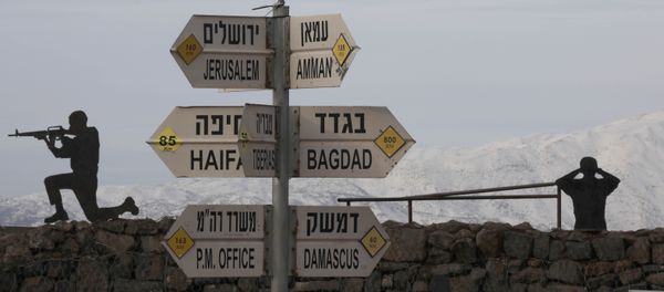 Silhouette sculptures of Israeli soldiers are pictured next to a sign for tourists showing the respective distances to Damascus and Baghdad from an army post on Mount Bental in the Israeli-annexed Golan Heights on January 20, 2019. Silhouette sculptures of Israeli soldiers are pictured next to a sign for tourists showing the respective distances to Damascus and Baghdad from an army post on Mount Bental in the Israeli-annexed Golan Heights on January 20, 2019. - Sputnik International