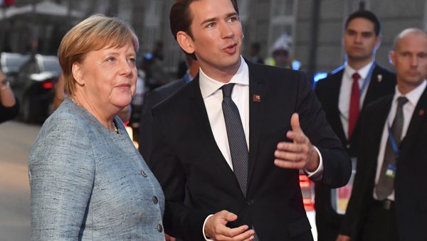 German Chancellor Angela Merkel talks to Austrian Chancellor Sebastian Kurz, right, when arriving at the informal EU summit in Salzburg, Austria, Wednesday, Sept. 19, 2018. - Sputnik International