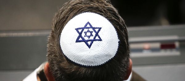 A member of the Christian Union party's faction wears a Jewish skullcaps, or kippa, during a debate at the German parliament Bundestag, about the 70th anniversary of the founding of the state Israel, in Berlin, Thursday, April 26, 2018 - Sputnik International