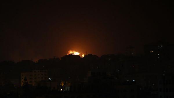 An explosion caused by Israeli airstrikes is seen on Gaza City, early Friday, March 15, 2019. An explosion caused by Israeli airstrikes is seen on Gaza City, early Friday, March 15, 2019. - Sputnik International