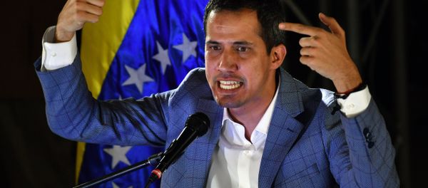 Venezuelan opposition leader and self-proclaimed interim president Juan Guaido delivers a speech during a meeting with local leaders in Caracas, on March 14, 2019. Venezuelans resumed work Thursday after a weeklong hiatus forced by an unprecedented nationwide blackout - Sputnik International