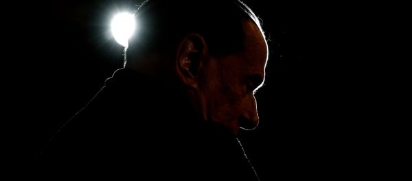 Leader of the Italian right-wing party Forza Italia (Go Italy) Silvio Berlusconi looks on during a campaign rally in Milan on February 25, 2018 Leader of the Italian right-wing party Forza Italia (Go Italy) Silvio Berlusconi looks on during a campaign rally in Milan on February 25, 2018 - Sputnik International