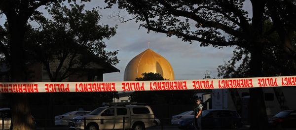 A police officer stands guard in front of the Masjid Al Noor mosque in Christchurch, New Zealand, Sunday, March 17, 2019, where one of two mass shootings occurred - Sputnik International