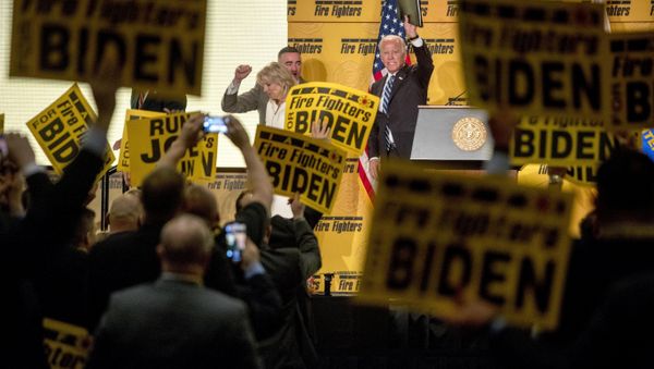 Former Vice President Joe Biden waves as he exits the stage with his wife, former second lady Jill Biden, left, after speaking at the International Association of Firefighters at the Hyatt Regency on Capitol Hill in Washington, Tuesday, March 12, 2019, amid growing expectations he'll soon announce he's running for president - Sputnik International