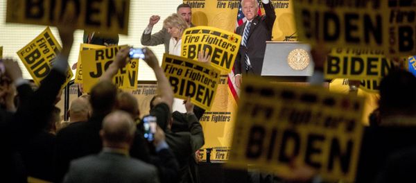 Former Vice President Joe Biden waves as he exits the stage with his wife, former second lady Jill Biden, left, after speaking at the International Association of Firefighters at the Hyatt Regency on Capitol Hill in Washington, Tuesday, March 12, 2019, amid growing expectations he'll soon announce he's running for president Former Vice President Joe Biden waves as he exits the stage with his wife, former second lady Jill Biden, left, after speaking at the International Association of Firefighters at the Hyatt Regency on Capitol Hill in Washington, Tuesday, March 12, 2019, amid growing expectations he'll soon announce he's running for president - Sputnik International