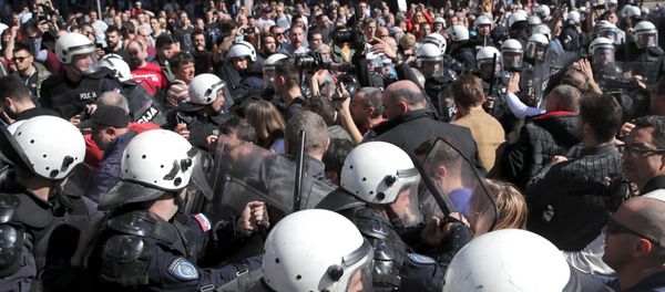 Demonstrators face-off with riot police at a protest against Serbian President Aleksandar Vucic and his government in front of the presidential building in Belgrade, Serbia, March 17, 2019. Demonstrators face-off with riot police at a protest against Serbian President Aleksandar Vucic and his government in front of the presidential building in Belgrade, Serbia, March 17, 2019. - Sputnik International