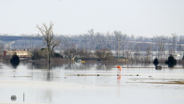An orange windsock is seen at Offutt Air Force Base in Bellevue, Neb., site of the bases' flooded runway, Sunday, March 17, 2019. - Sputnik International