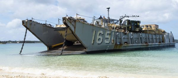 Landing Craft, Utility (LCU) 1651, assigned to Naval Beach Unit (NBU) 7, stands by to retrieve Marines assigned to the 31st Marine Expeditionary Unit (MEU) during a simulated beach raid. The amphibious transport dock ship USS Green Bay (LPD 20), part of the Commander Amphibious Squadron 11, is operating in the region to enhance interoperability with partners and serve as a ready-response force for any type of contingency. Landing Craft, Utility (LCU) 1651, assigned to Naval Beach Unit (NBU) 7, stands by to retrieve Marines assigned to the 31st Marine Expeditionary Unit (MEU) during a simulated beach raid. The amphibious transport dock ship USS Green Bay (LPD 20), part of the Commander Amphibious Squadron 11, is operating in the region to enhance interoperability with partners and serve as a ready-response force for any type of contingency. - Sputnik International